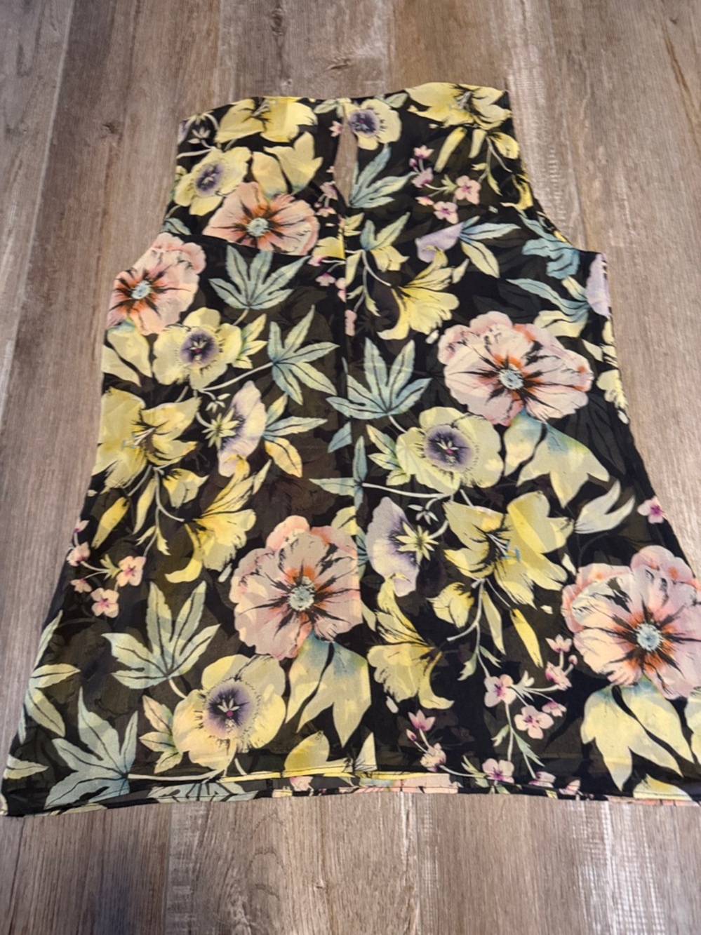 CAbi Osaka Nights floral ruffle sleeveless blouse.
